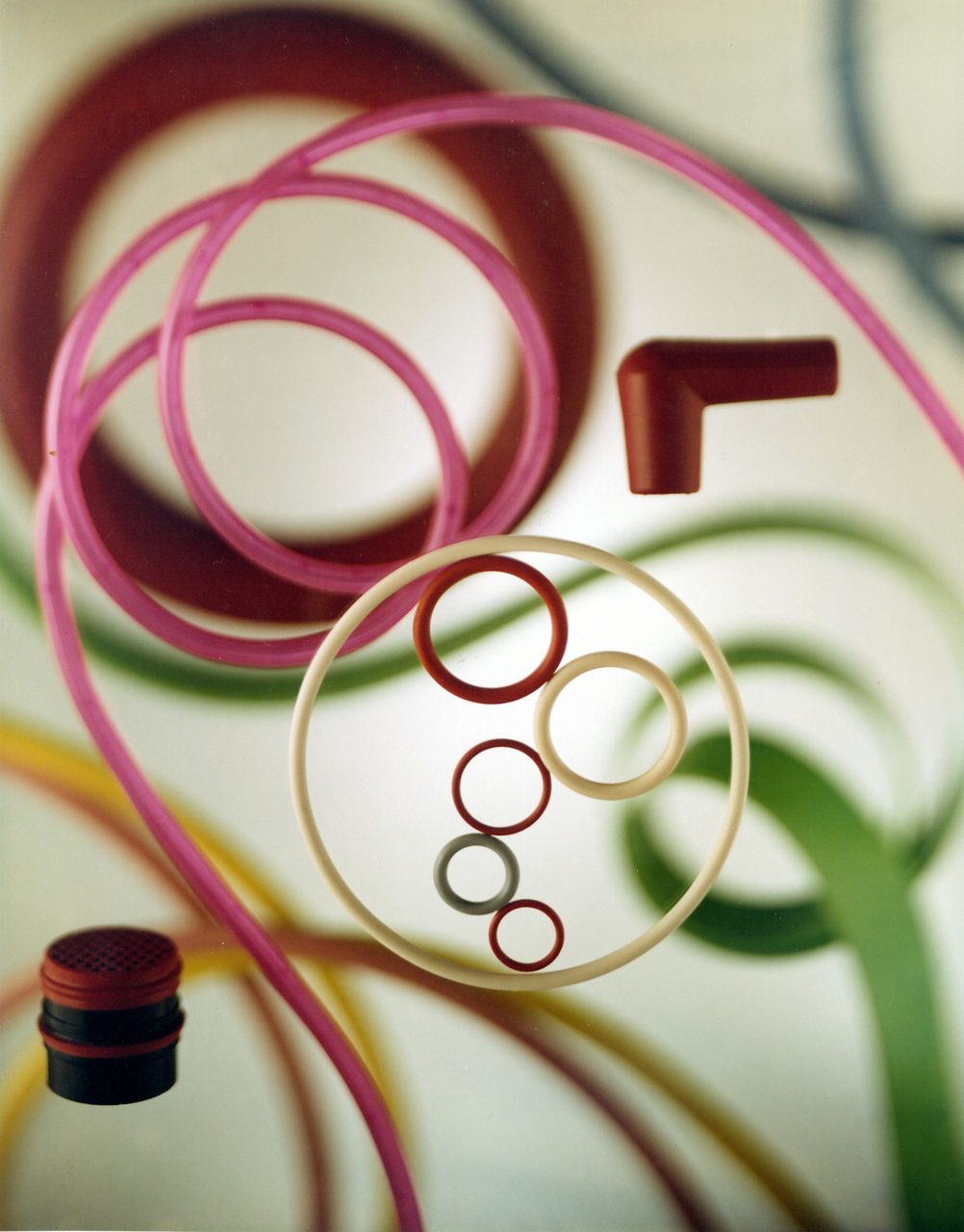 Molded SILASTIC fluorosilicone rubber parts, including O-rings, weatherseals, electronic connector insulators and sparkplug boots. 