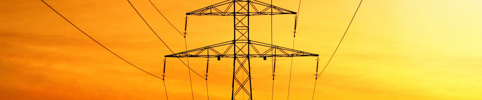 Electrical power transmission with tower at sunset