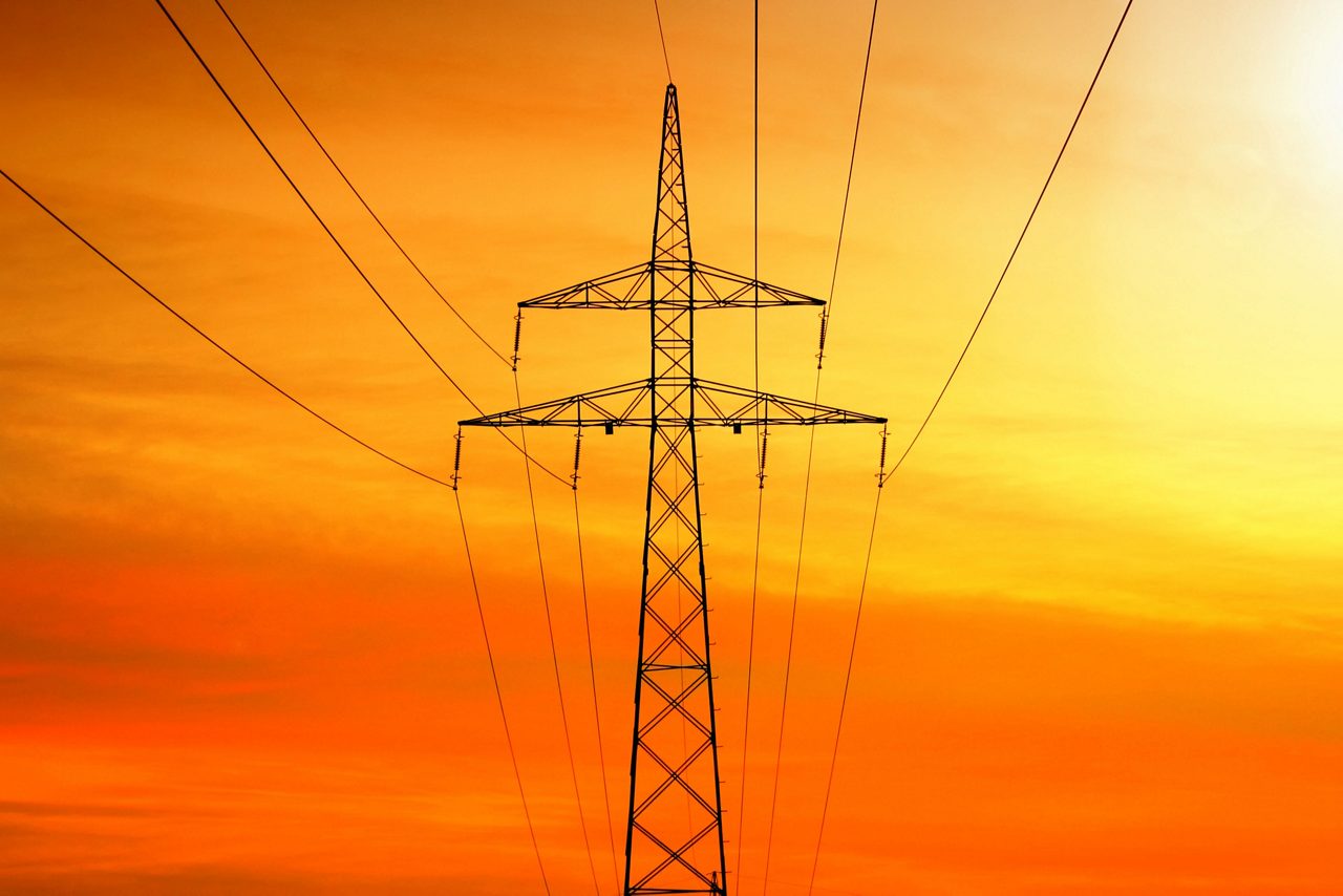 Electrical power transmission with tower at sunset