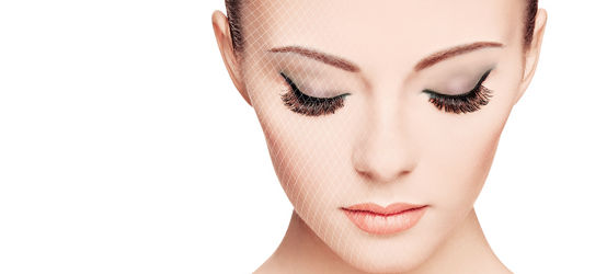 Woman with dark eyeshadow looking down, diamond netting texture.