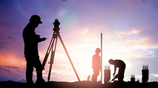 silhouette survey engineer working  in a building site over Blurred construction worker on construction site Silhouette of a survey engineer over a blurred worker on a construction site. / 123rf Image #44803465