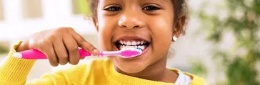 Child brushing teeth 