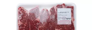 Fresh red meat packed in a poly bag.