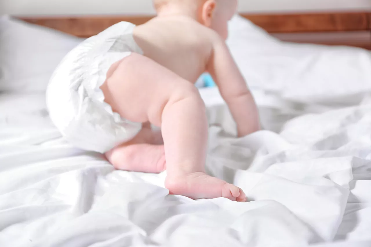 Baby crawling in a diaper