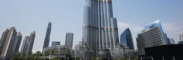 Burj Khalifa against clear sky with clear ocean in the foreground