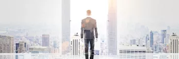 Success concept with businessman standing in front of open double door with New York city view and sunlight. Double exposure