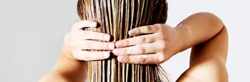 Woman applying hair conditioner