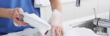 A man washing dishes