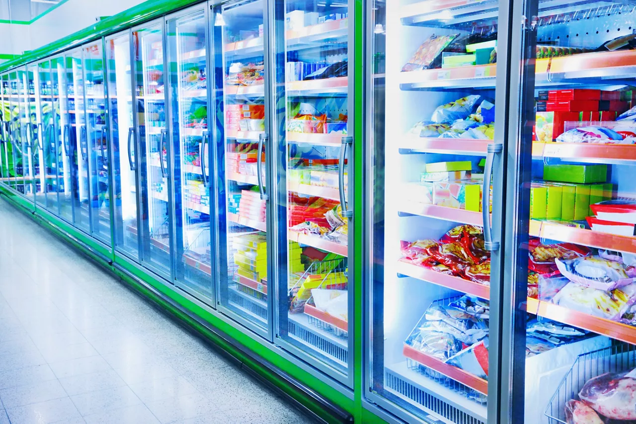 Large fridges with various items of food in a supermarket