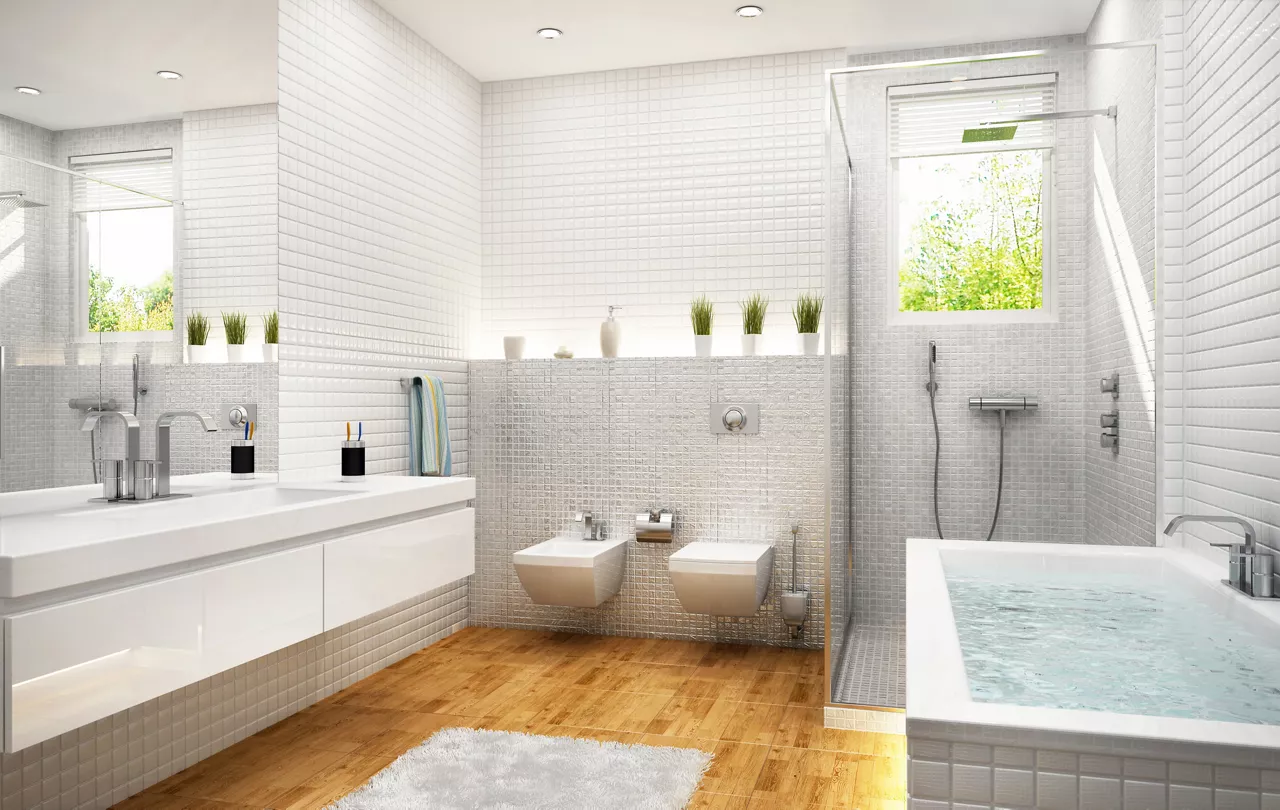 Modern white tile bathroom with separate tub and shower cubicle.