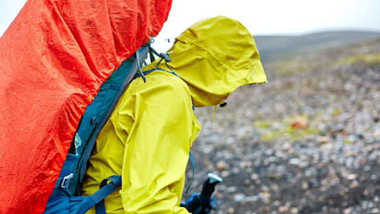 Hiker in the mountains, hiking in the rain