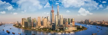 Shanghai city with river front and transportation boat and blue sky, shang hai, china, asia