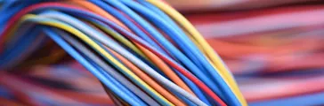 Macro photograph of various colorful cables or cords wound together