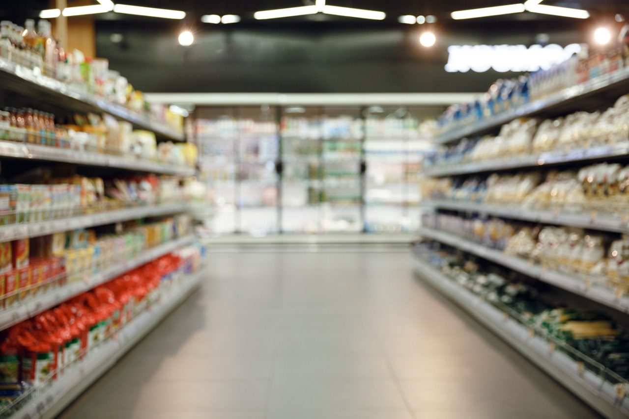 Packaging on shelves in grocery store aisle