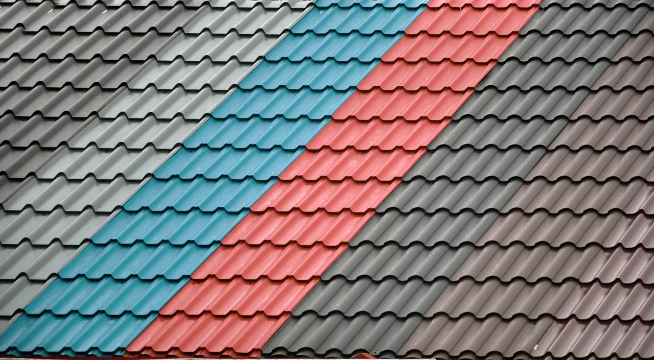 Texture of a metal roof tiles of black, blue and red colors