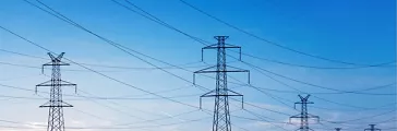 Landscape of power lines over a blue sky