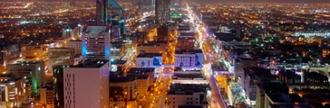 Lights from a city skyline at night.