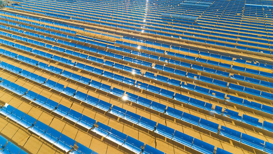Aerial view of a solar farm producing clean renewable sun energy in California, industrial landscape