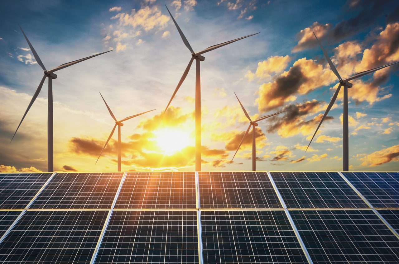 Wind Turbines and Solar Panels at Sunset