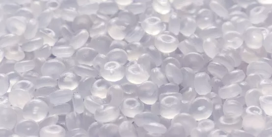 Polypropylene granule close-up background texture.