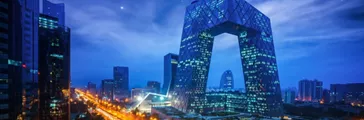 Night cityscape with buildings and road in Beijing, China 