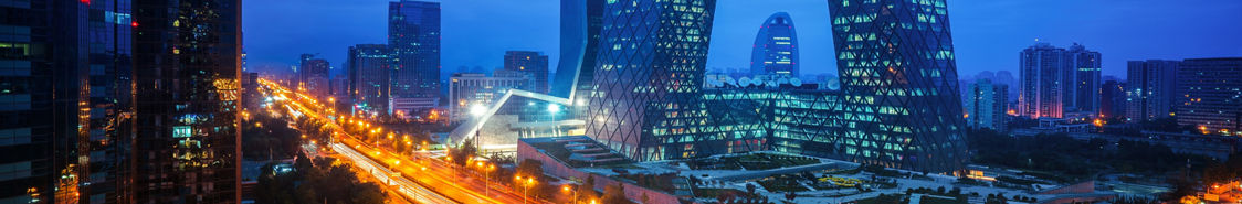 Night cityscape with buildings and road in Beijing City, China