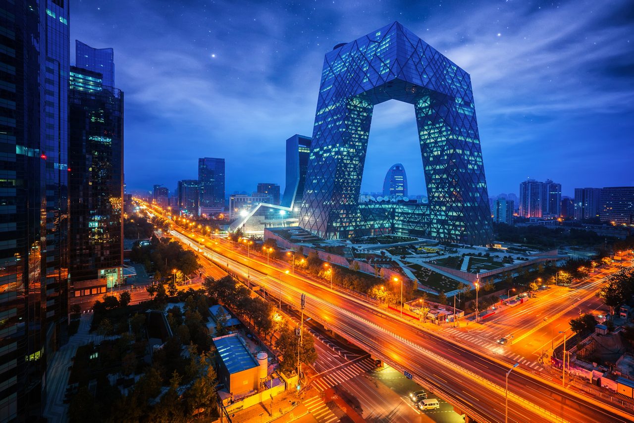 Night cityscape with buildings and road in Beijing City, China