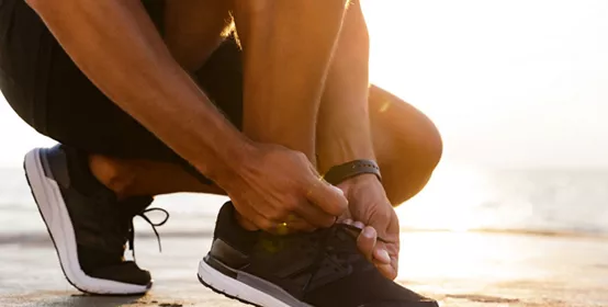Person tying shoe