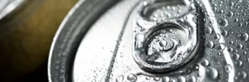 Close-up of aluminum cans with condensation