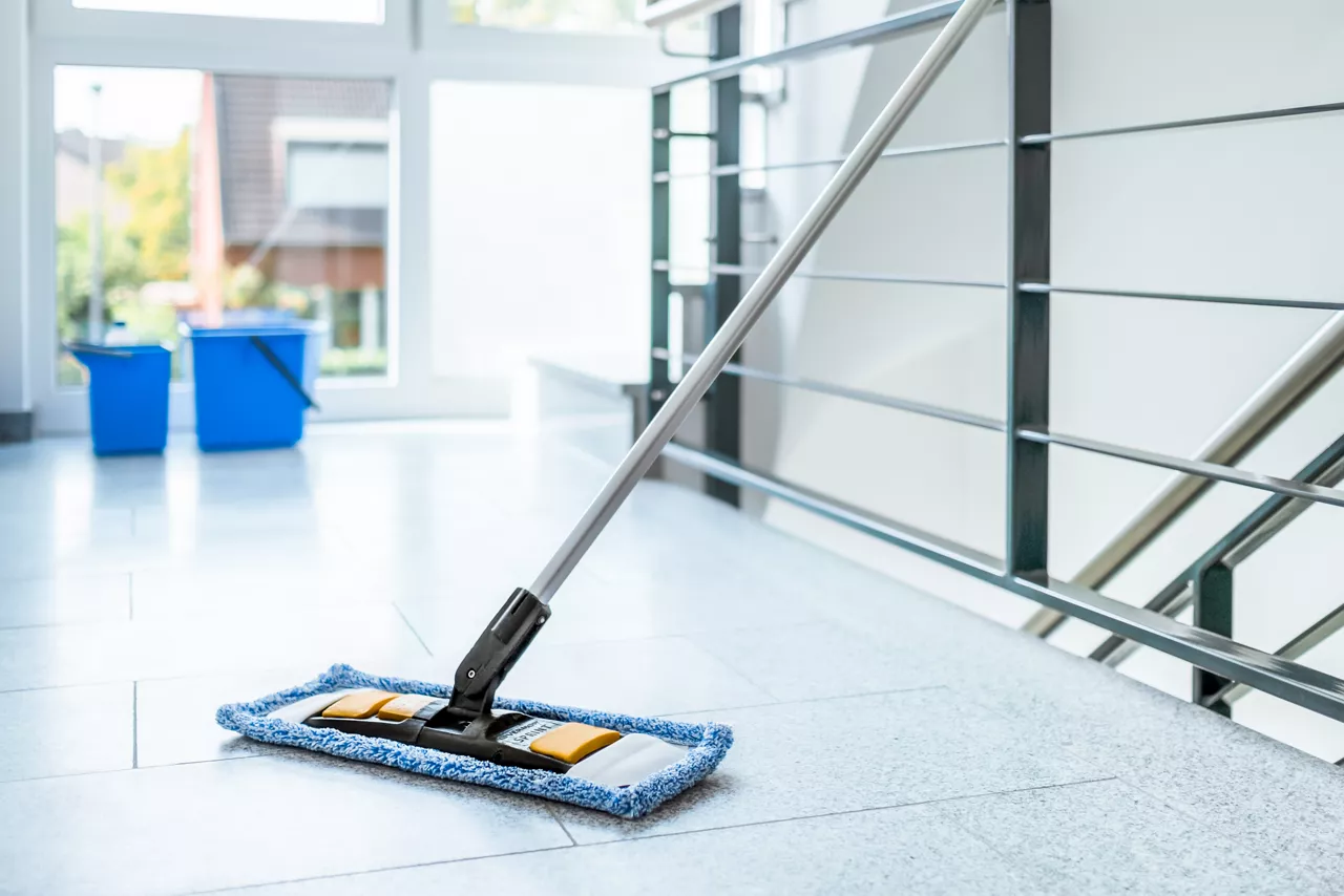 Cleaning the staircase with mop