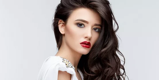 Brunette asian girl with long curly hair