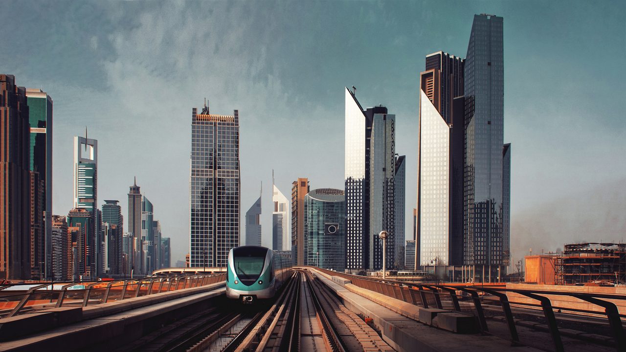 Skyscrapers and above ground subway of large modern city. 