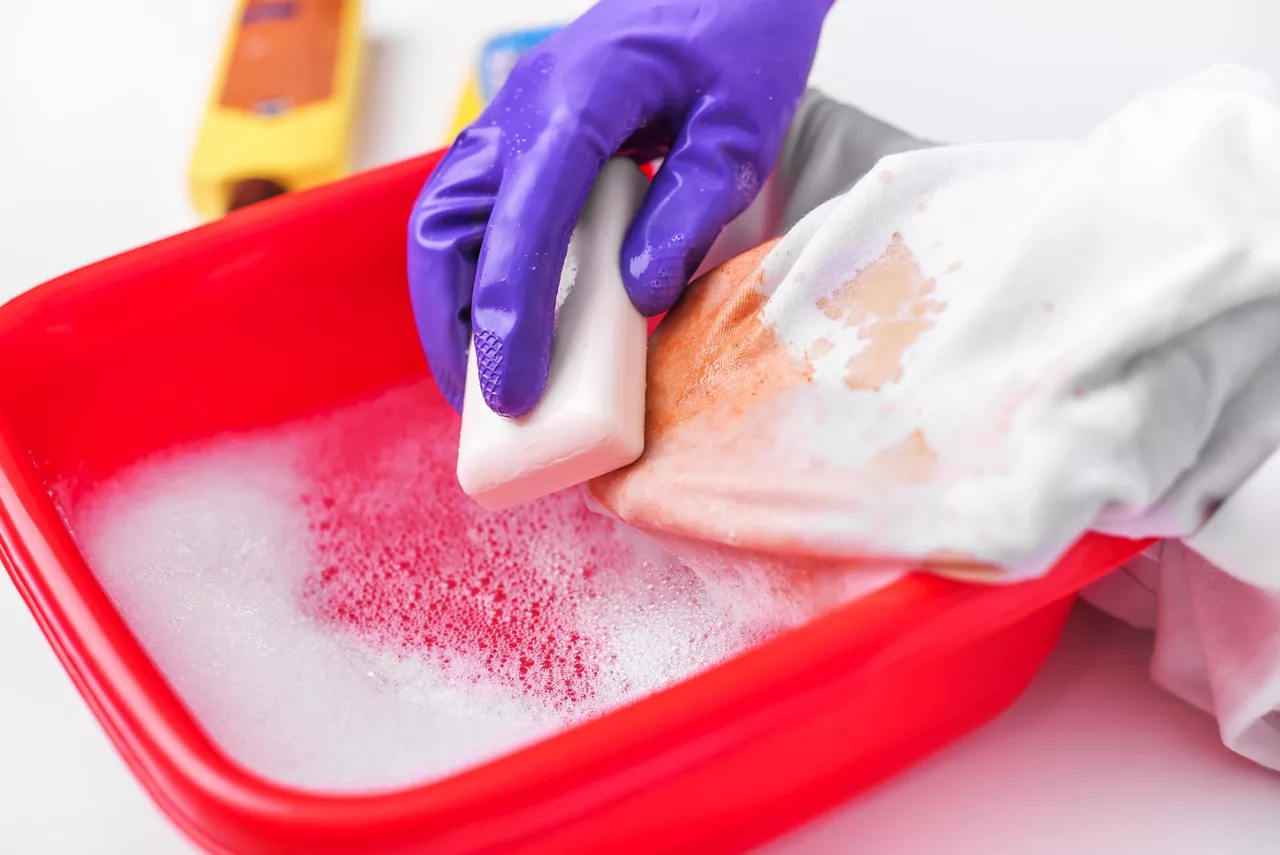Wash stain with soap bar  