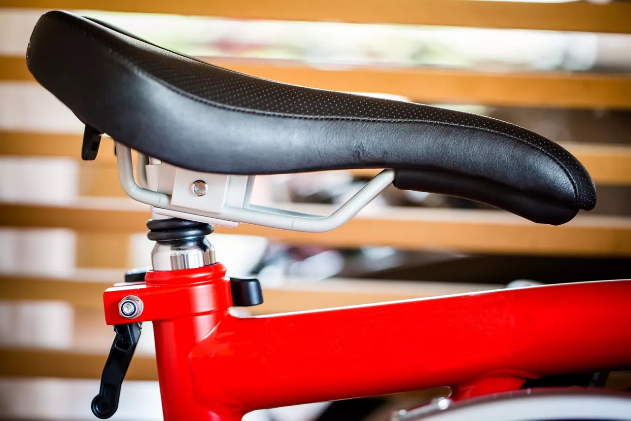 Close-up of black bicycle saddle.