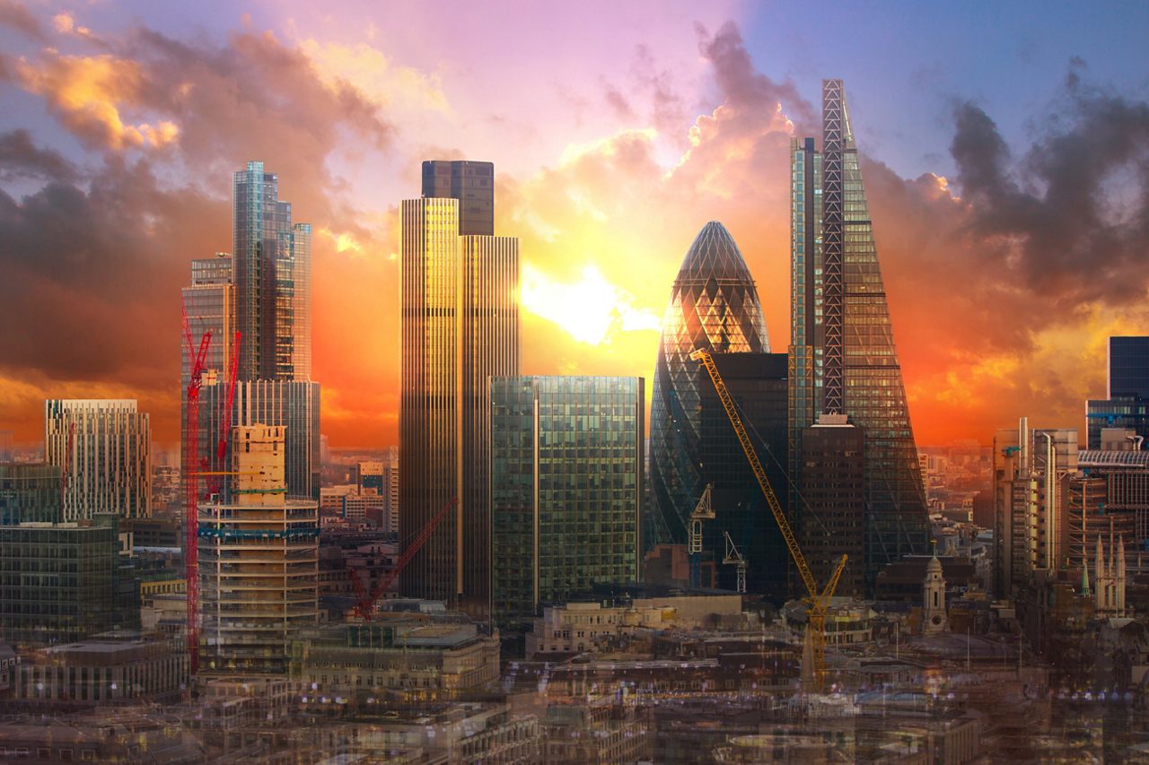 London skyline at sunset showing city rooftops 