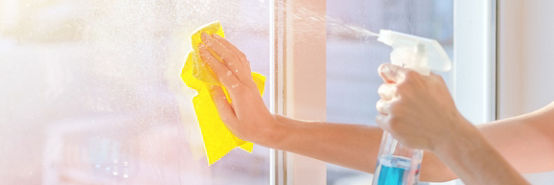 Hands with napkin cleaning window. Washing the glass on the windows with cleaning spray. Selective soft focus. Empty place for text, copy space.
Window cleaning home.