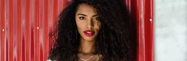 Fashionable black woman with red lipstick and natural hair