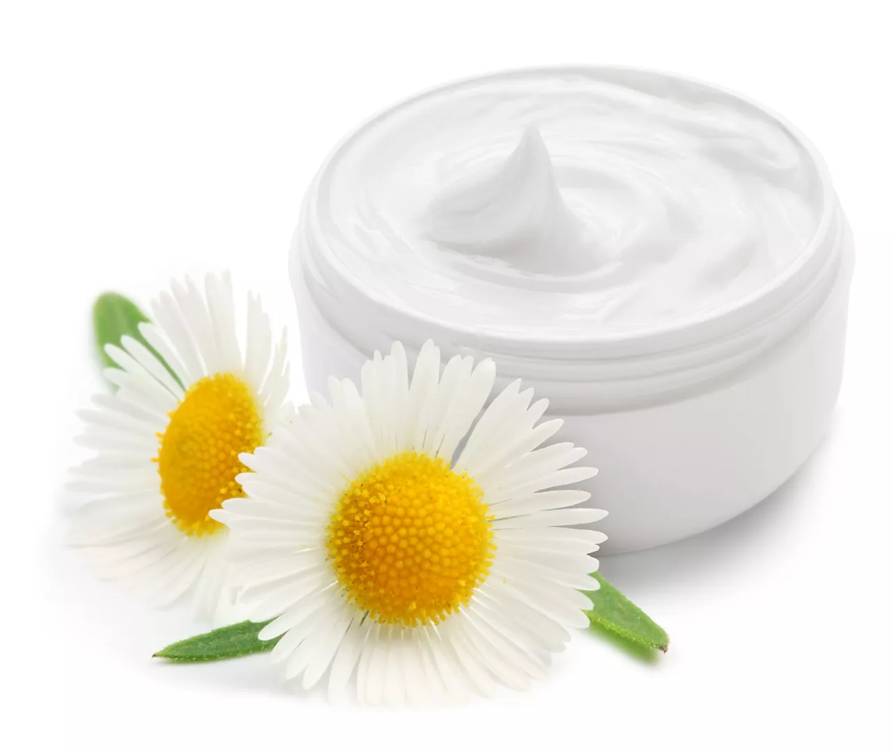 Opened plastic container with cream and camomile on a white background.