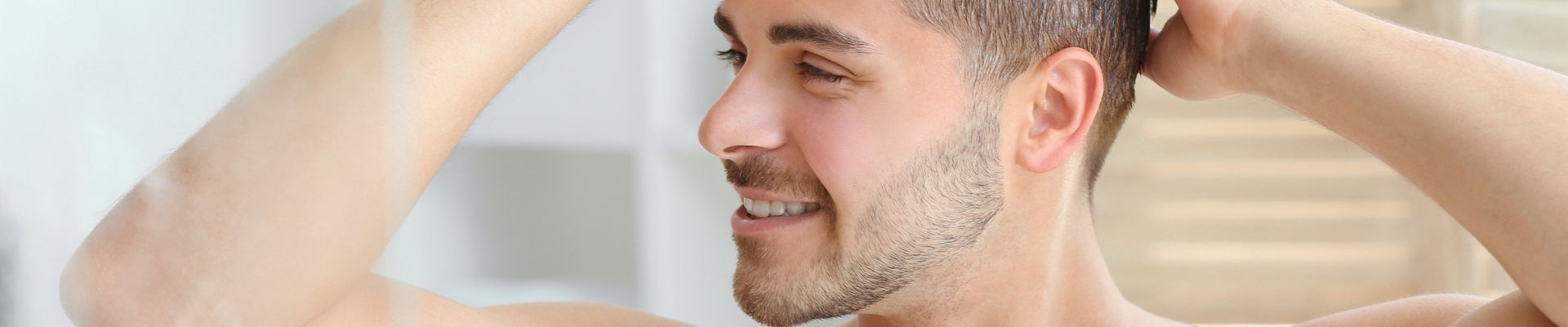 Man washing hair in shower