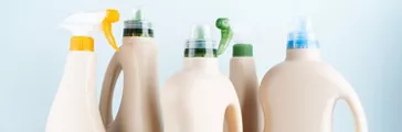 Close-up of cleaning products on blue white background overview 