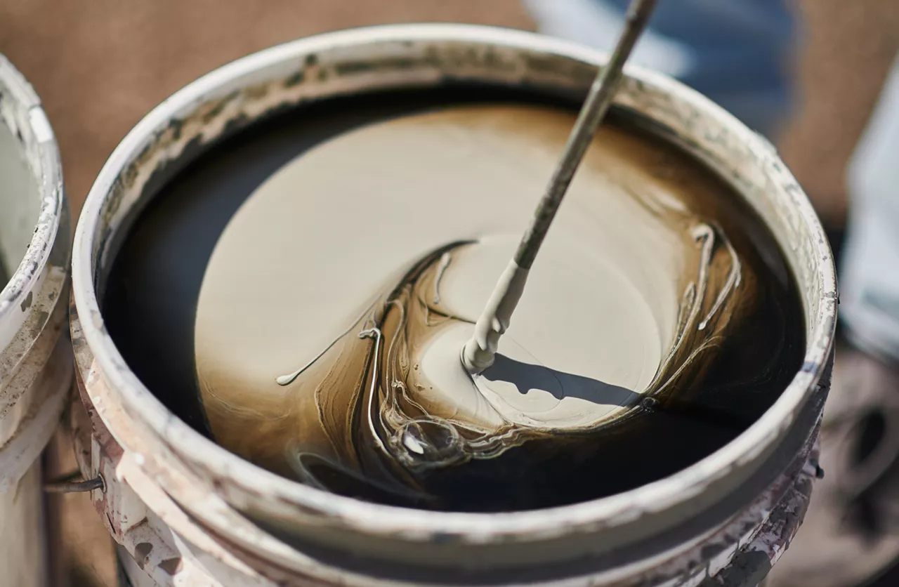 Mixing epoxy for self-leveling floor in a bucket