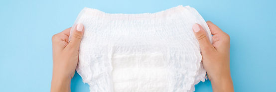 Baby diaper on blue background 