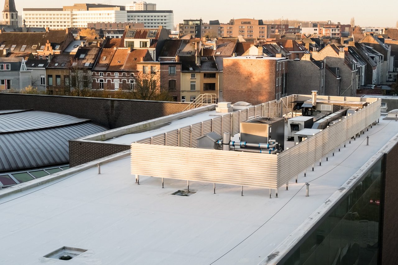 in a big city there is a zinc roof on a high building