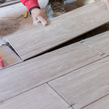 Woodworker lays down laminate