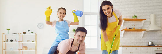 Happy family cleans the room in the house