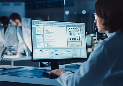 Scientist working in front of computer in the lab