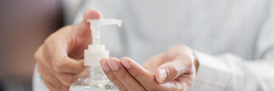 Man hands using wash hand alcohol gel or sanitizer bottle dispenser, against Novel coronavirus or Corona Virus Disease (Covid-19) . Antiseptic, Hygiene and Health concept