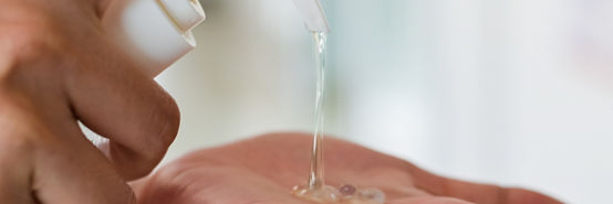 Hand sanitizer,Close up Woman hands using wash hand sanitizer gel dispenser prevention coronavirus, Selected focus Shallow DOF