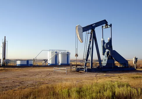 Oil well and storage tanks in the Texas Panhandle.