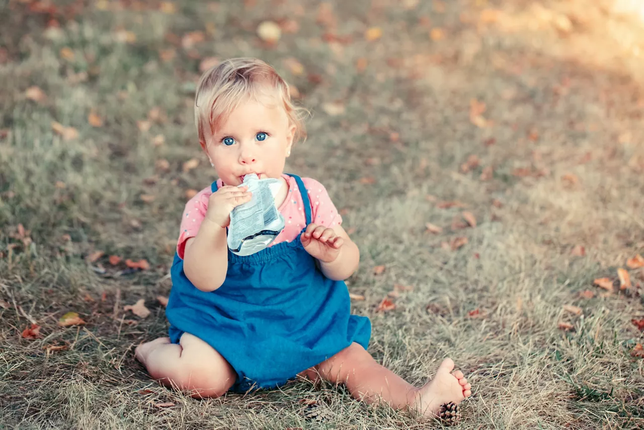 Baby drinking from a stand up pouch 